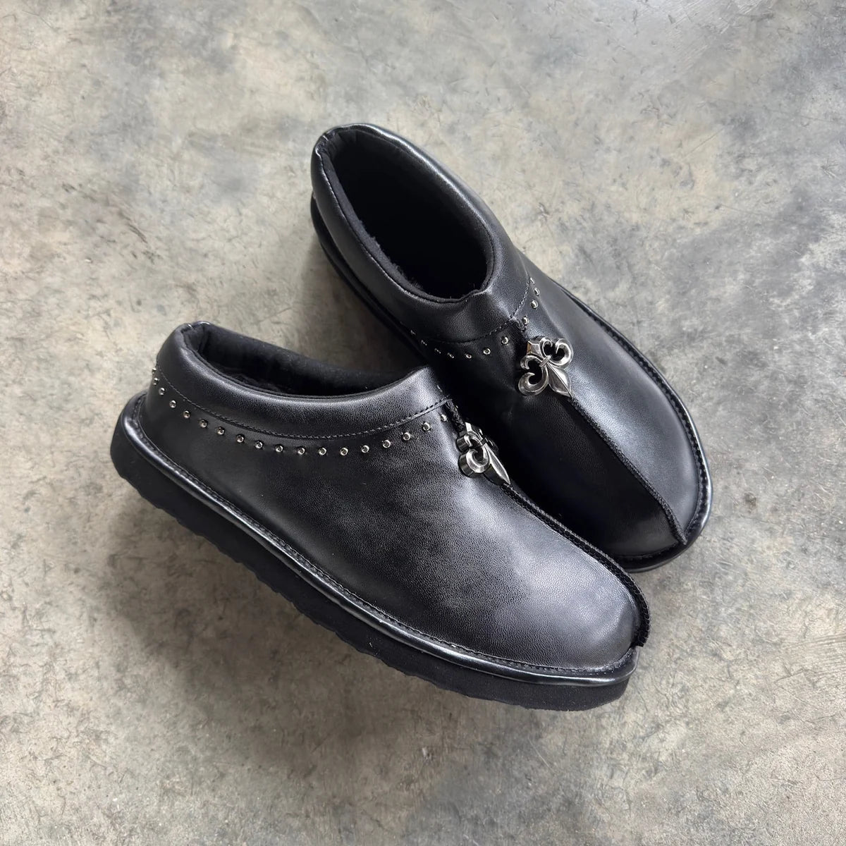 Black Chrome Fleur Mules angled view